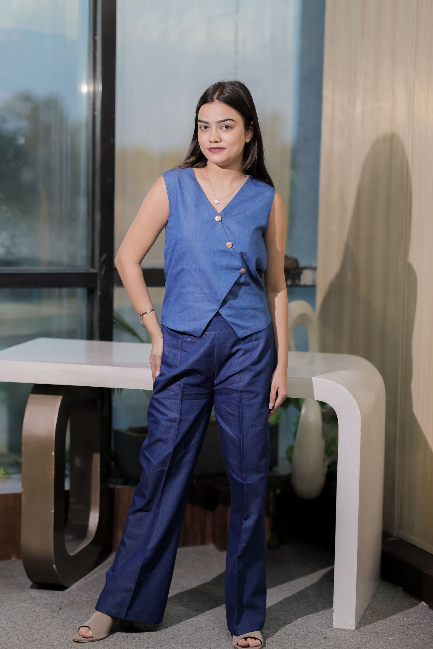 Mid blue denim co ord set with gold buttons on waistcoat and pants- esseneur.
