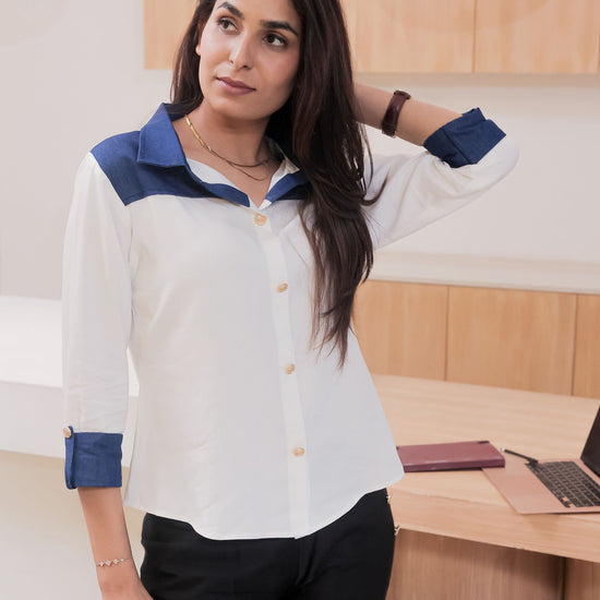 White shirt with dark blue denim on shoulder-esseneur
