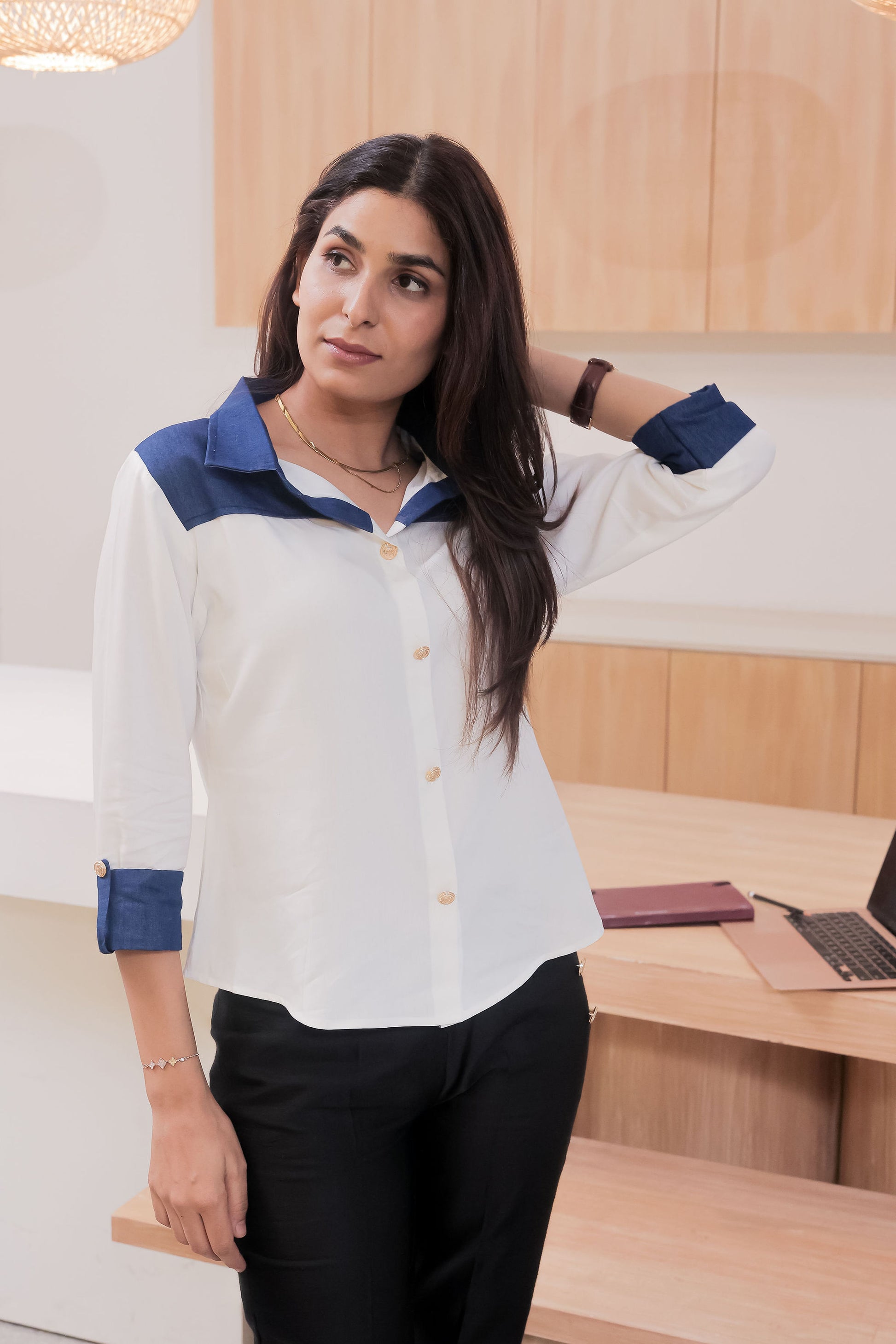 White shirt with dark blue denim on shoulder-esseneur